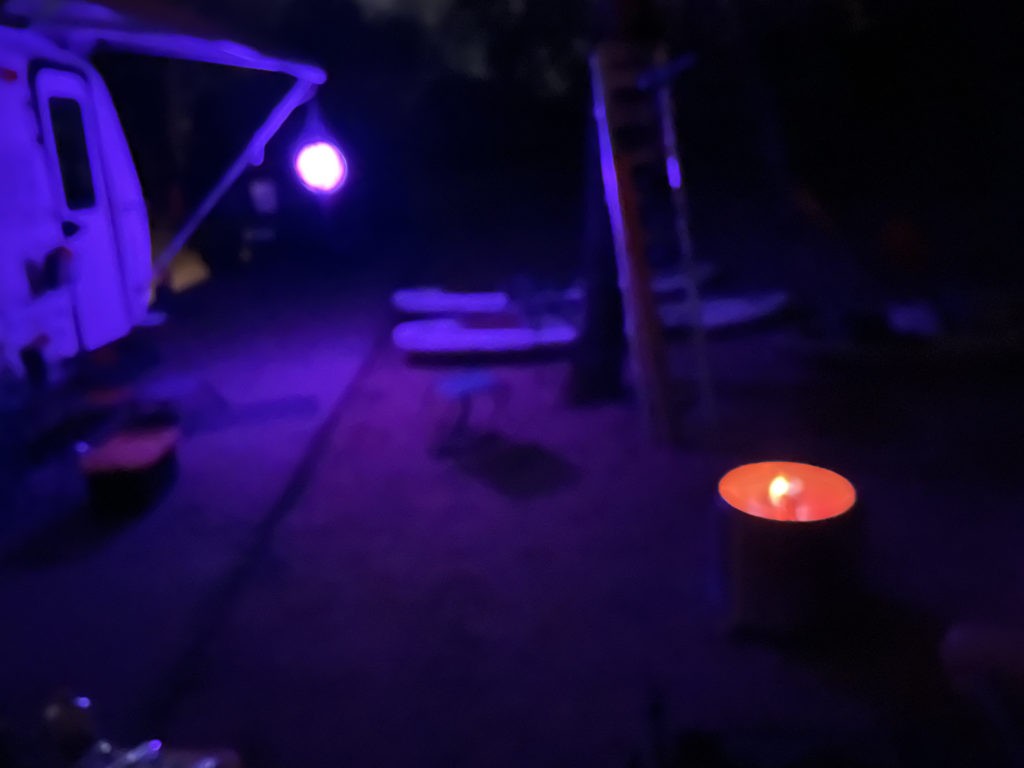 Casita at night with Solo Stove and blue hue.
